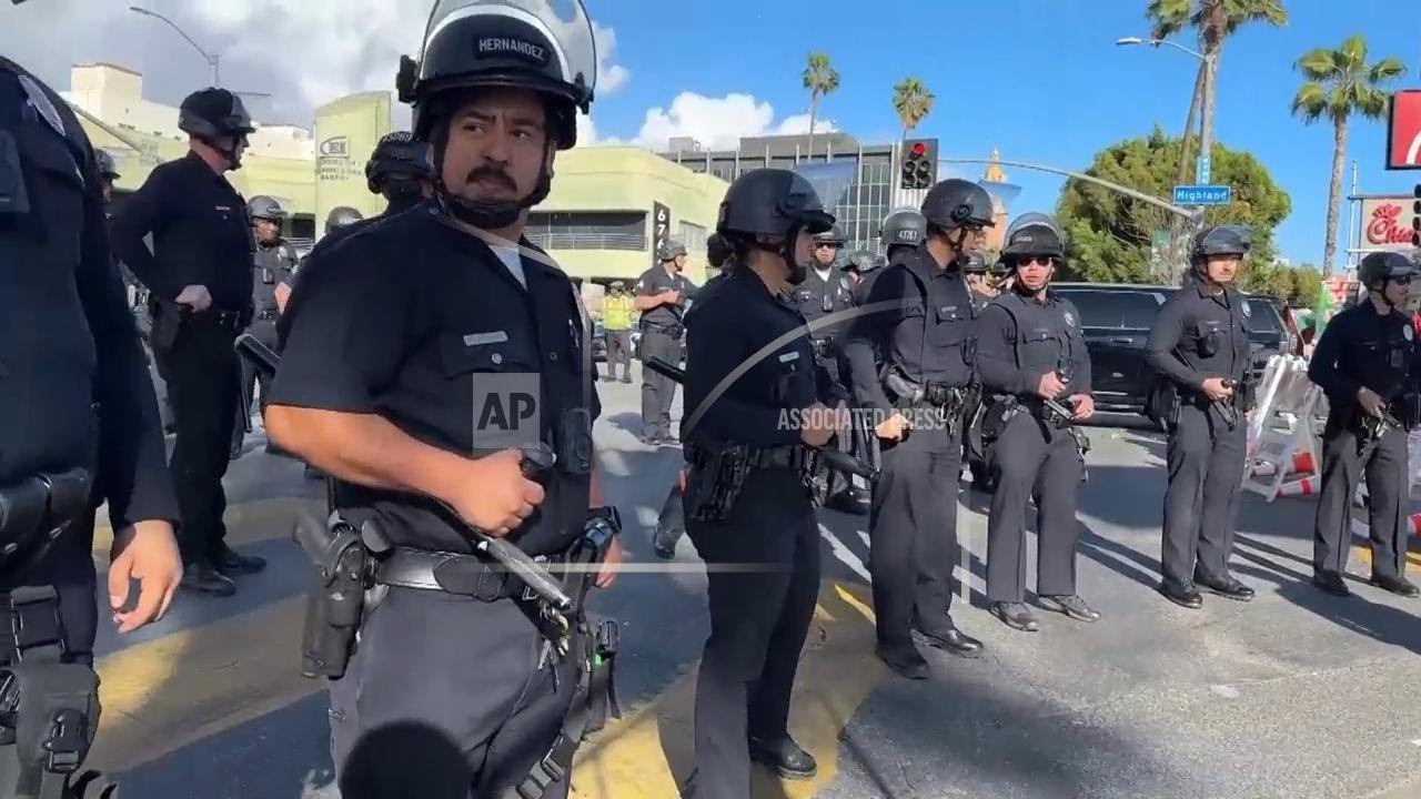 Protest briefly pauses Oscars red carpet